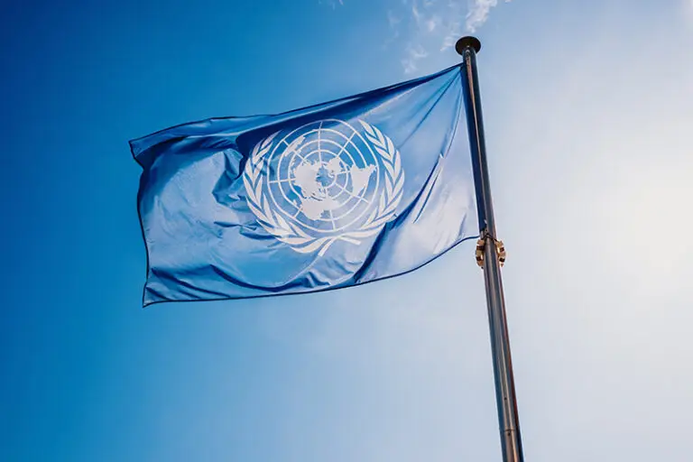 Un,Flag,Waved,Against,The,Sun,And,Blue,Sky
