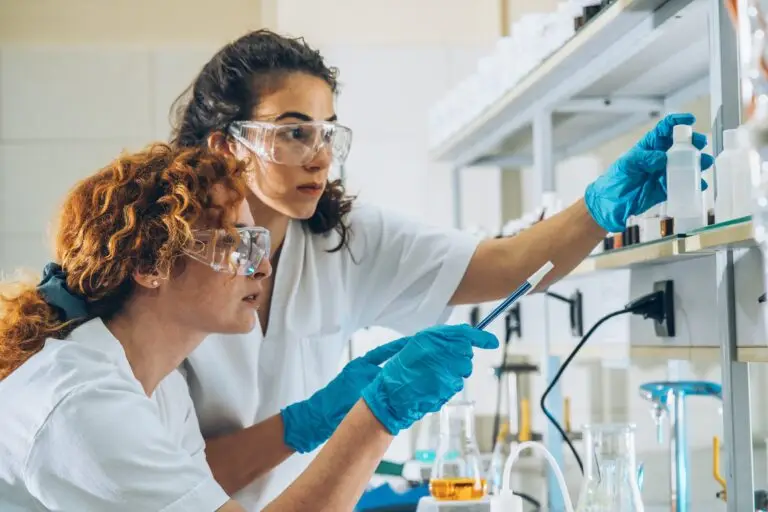 In,A,Chemistry,Lab,,Two,Diligent,Workers,Conduct,Experiments,,Kindling